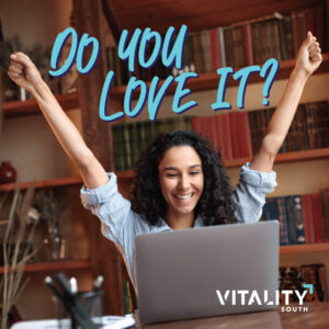 Woman sitting in front of computer cheering with "Do you love it?" above her head