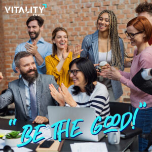 Image of a group of mix men and women with the text "Be The Good" on top