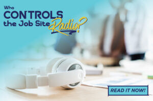 Blog post graphic featuring white over-ear headphones resting on a desk with a blurred office background. Overlaid text reads: 'Who CONTROLS the Job Site Radio?', with a 'READ IT NOW!' button in the bottom right corner.